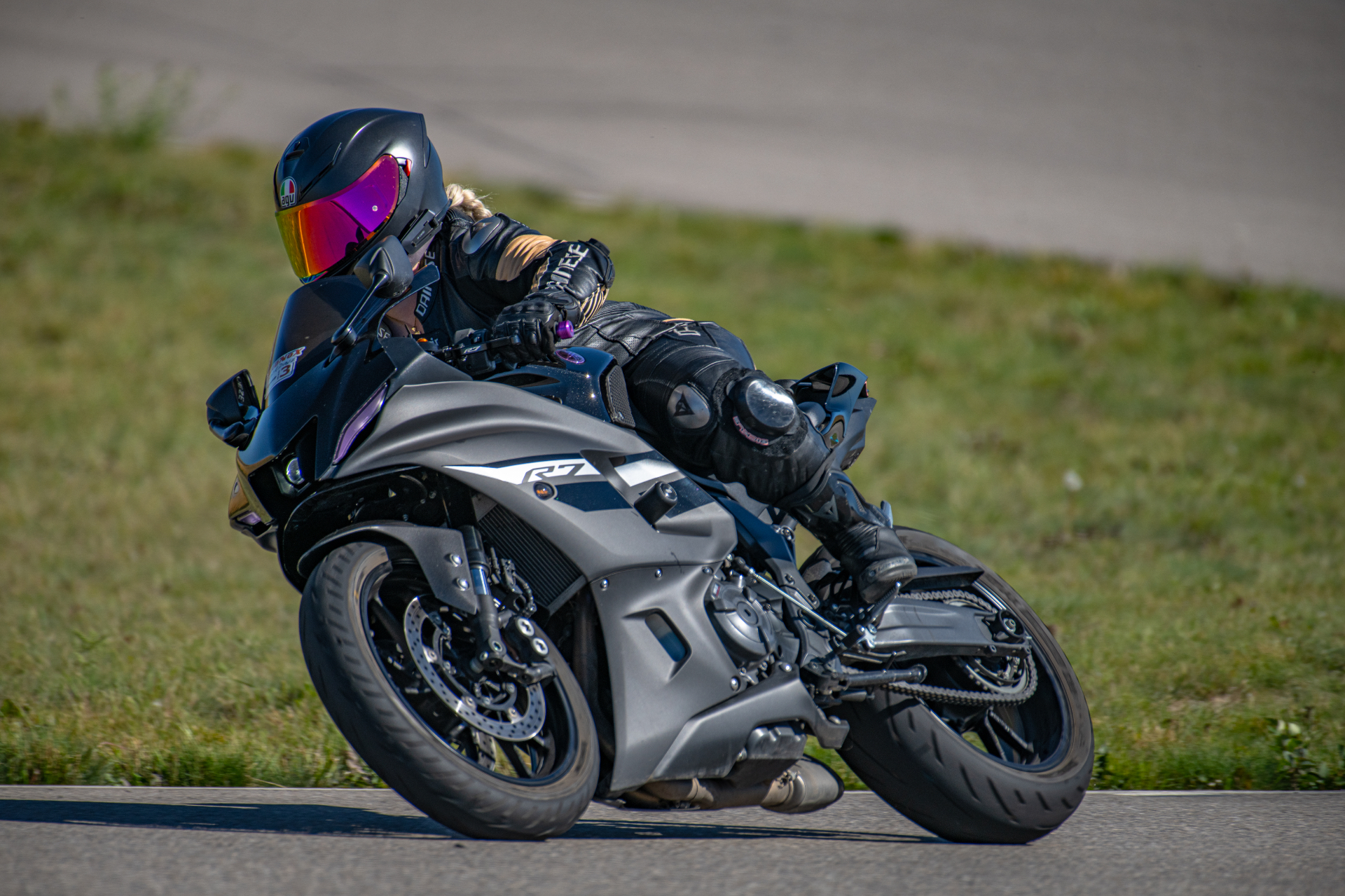 Sandy leaning into a corner on her Yamaha R7 motorcycle